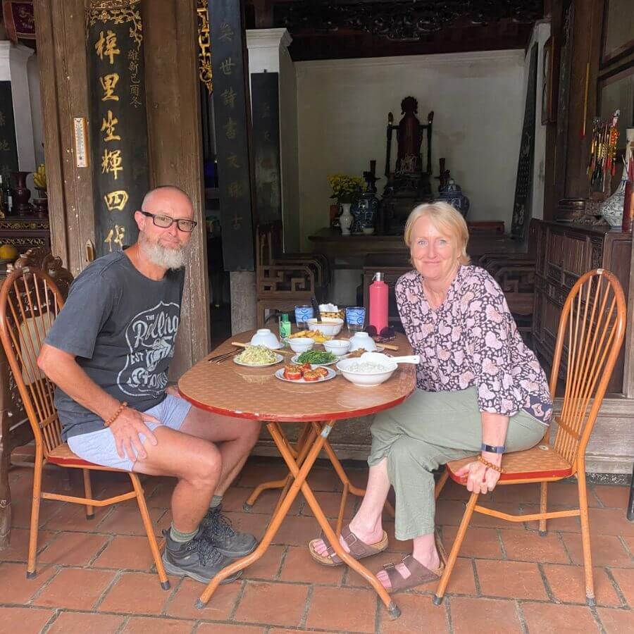 A couple visit Duong Lam Village in hanoi countryside village tour