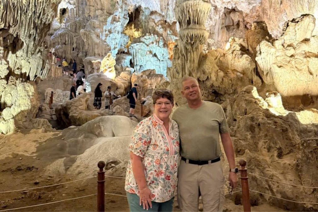 A couple visit Surprise Cave in Halong Bay Day Tour