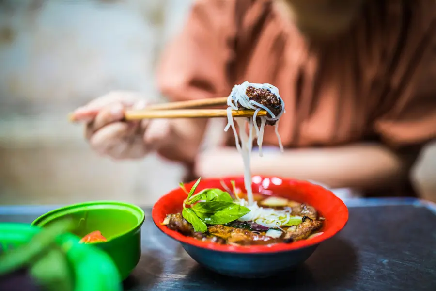 Bun cha with grilled pork, rice noodles and herbs in Hanoi