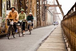 Cycling along Long Bien Bridge