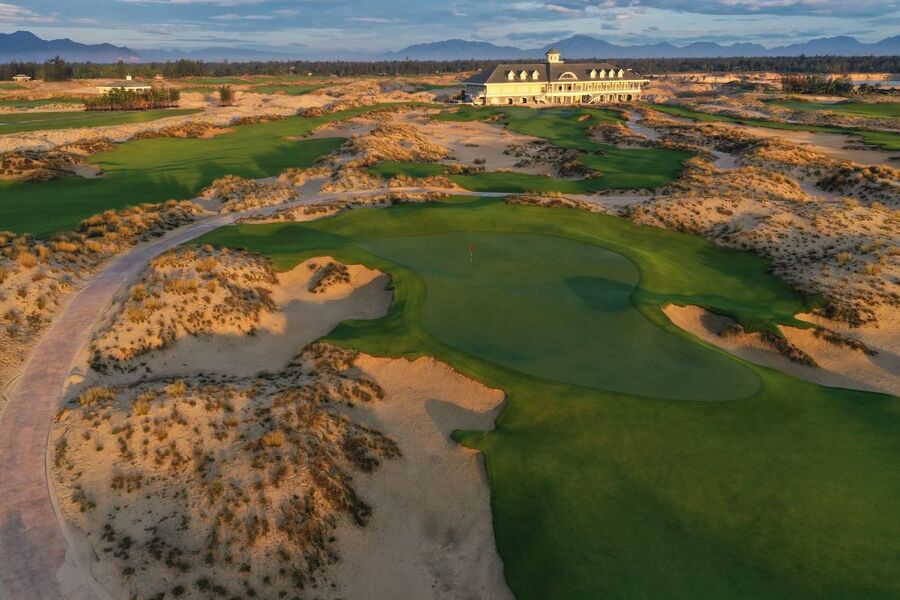 Aerial view of fairways and coastal dunes at Hoiana Shores Golf Club near Hoi An