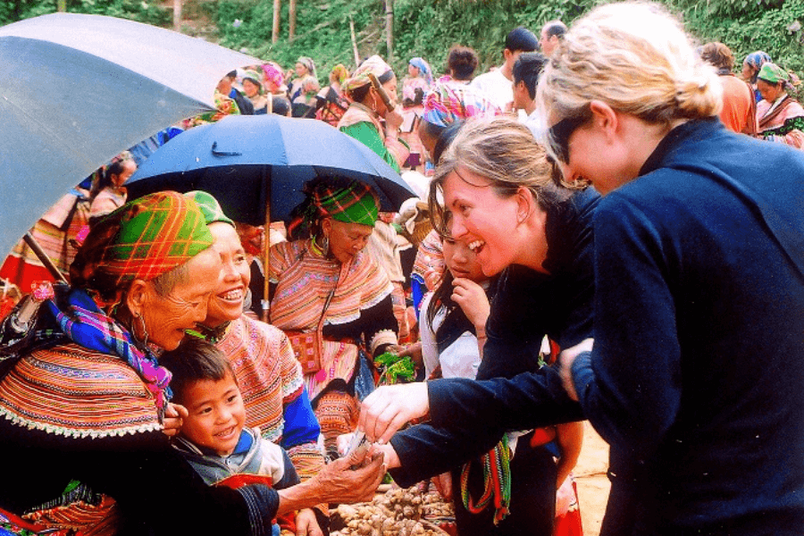 Foreigner visitors with ethnic minorities people in Hanoi to Sapa day trip