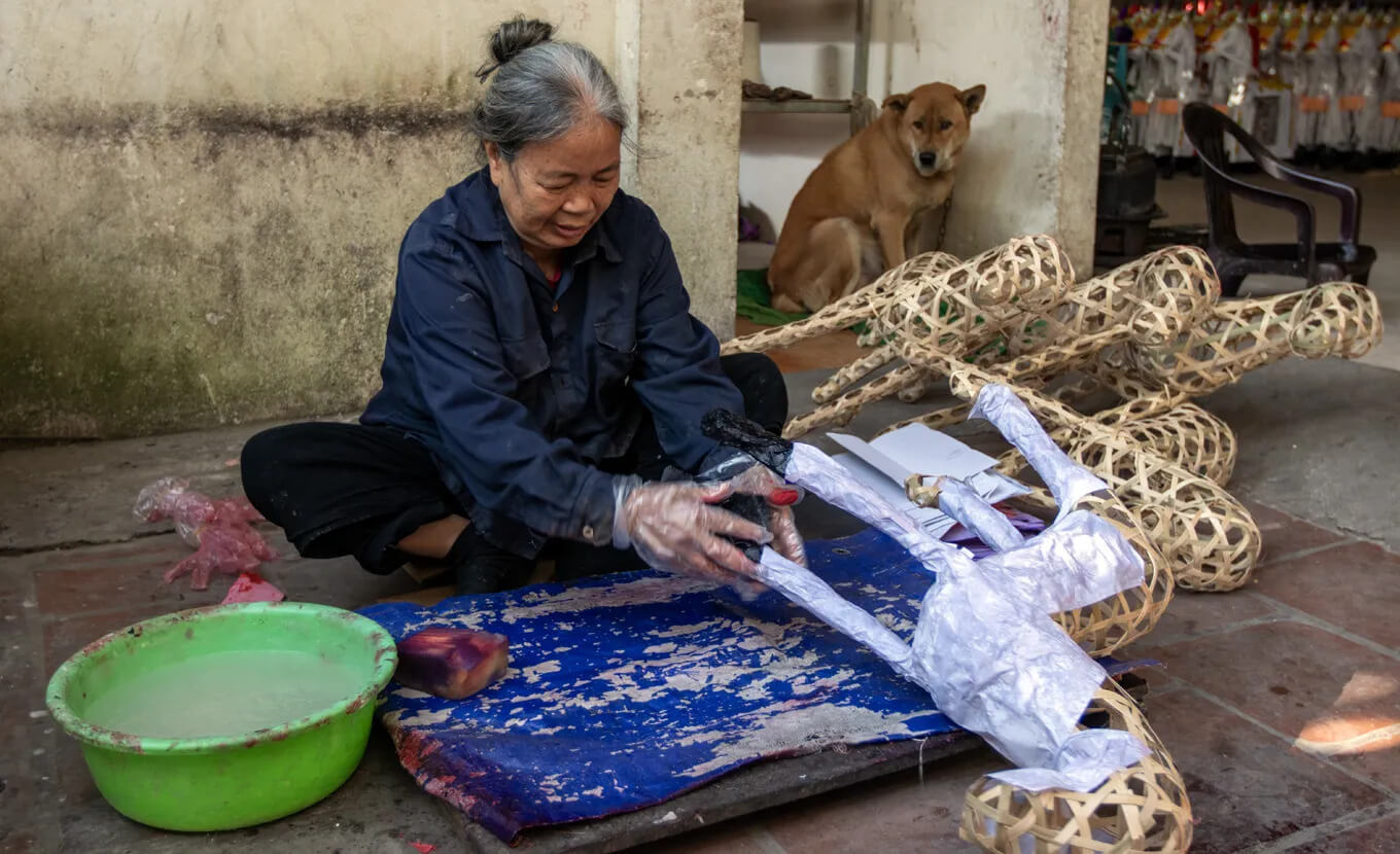 Making votive paper in Phuc Am Village - Hanoi Tours