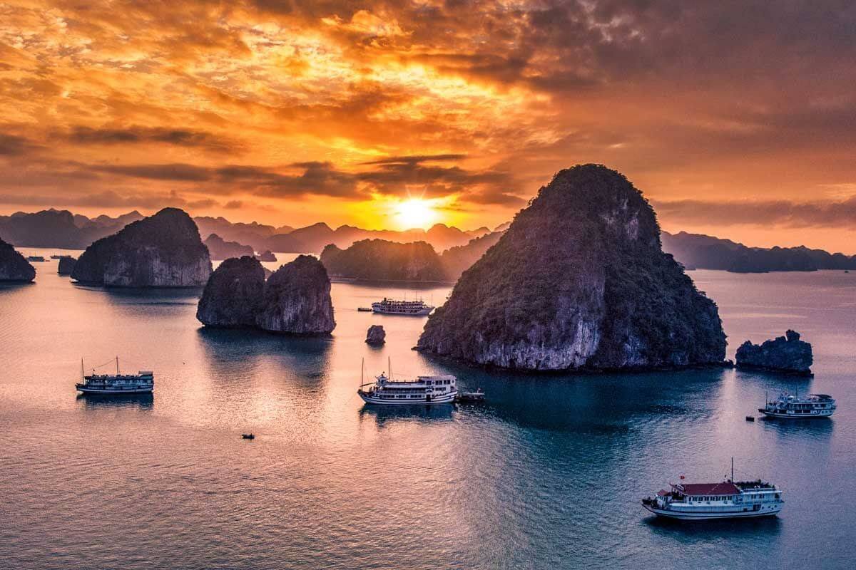 Sunset in Ha Long Bay, ideal place for Hanoi Vietnam vacation packages