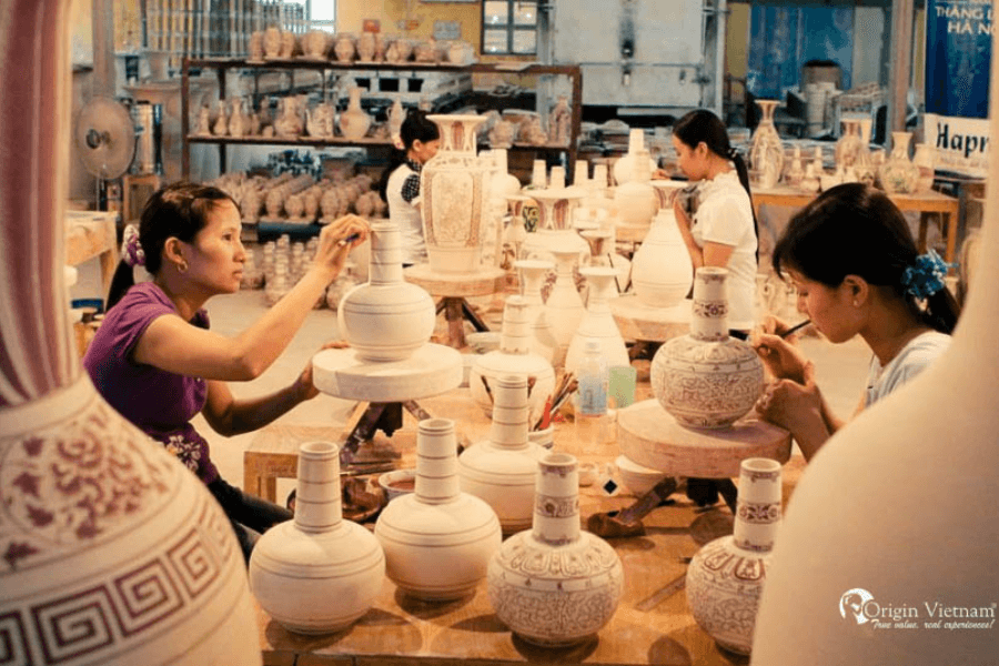 Watching craftman is doing the pottery making process in countryside tour