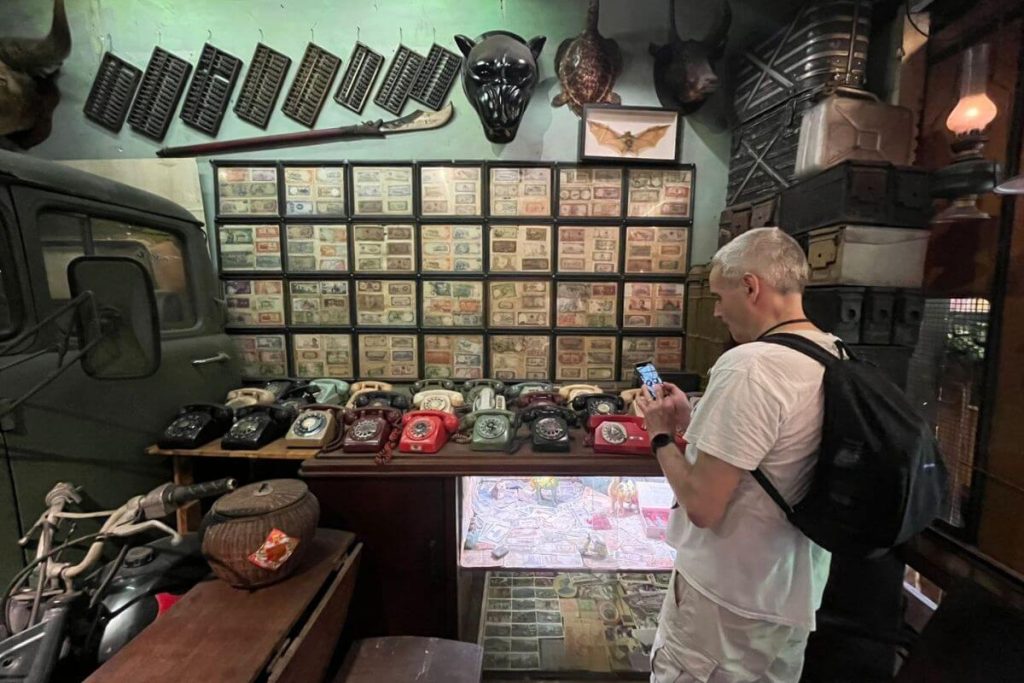 a man visit antique market hanoi