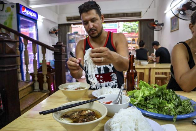 eat bun cha in hanoi tours