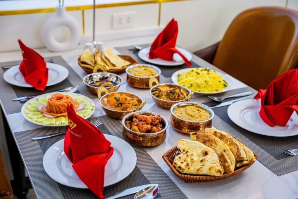experience authentic Indian cuisine prepared by a dedicated Indian chef onboard