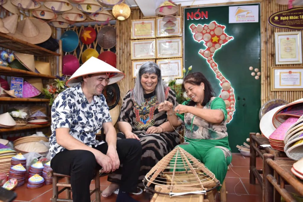 experience making conical hat in chuong village hanoi tours