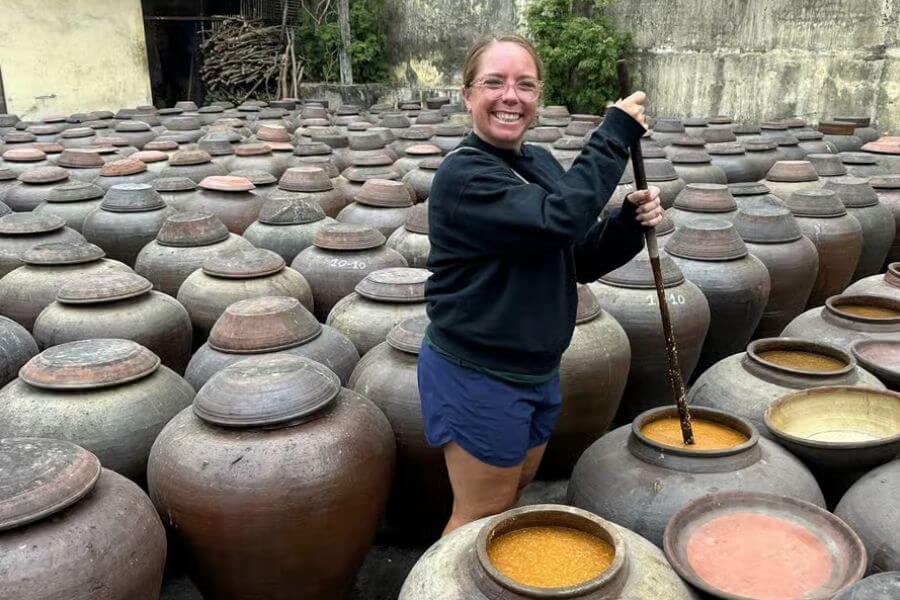 happy customer in ban yen nhan soy sauce village tour - hanoi local tour