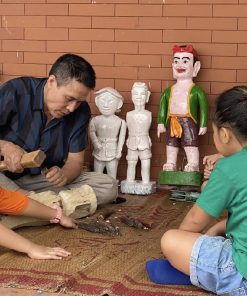 learn about making water puppetry with artisans in Dao Thuc Village