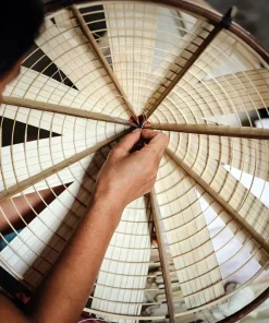 making non la in chuong conical hat village - hanoi day tours