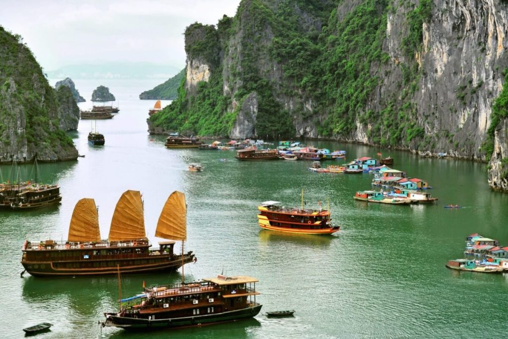 transfer to Tuan Chau Marina to begin cruise through Ha Long Bay