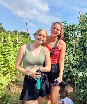 two women visit vegetable farm in Manh's Farm Tour And Home Cooking Class in Hanoi