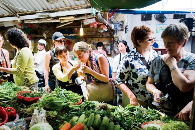 visit a market in tours from hanoi